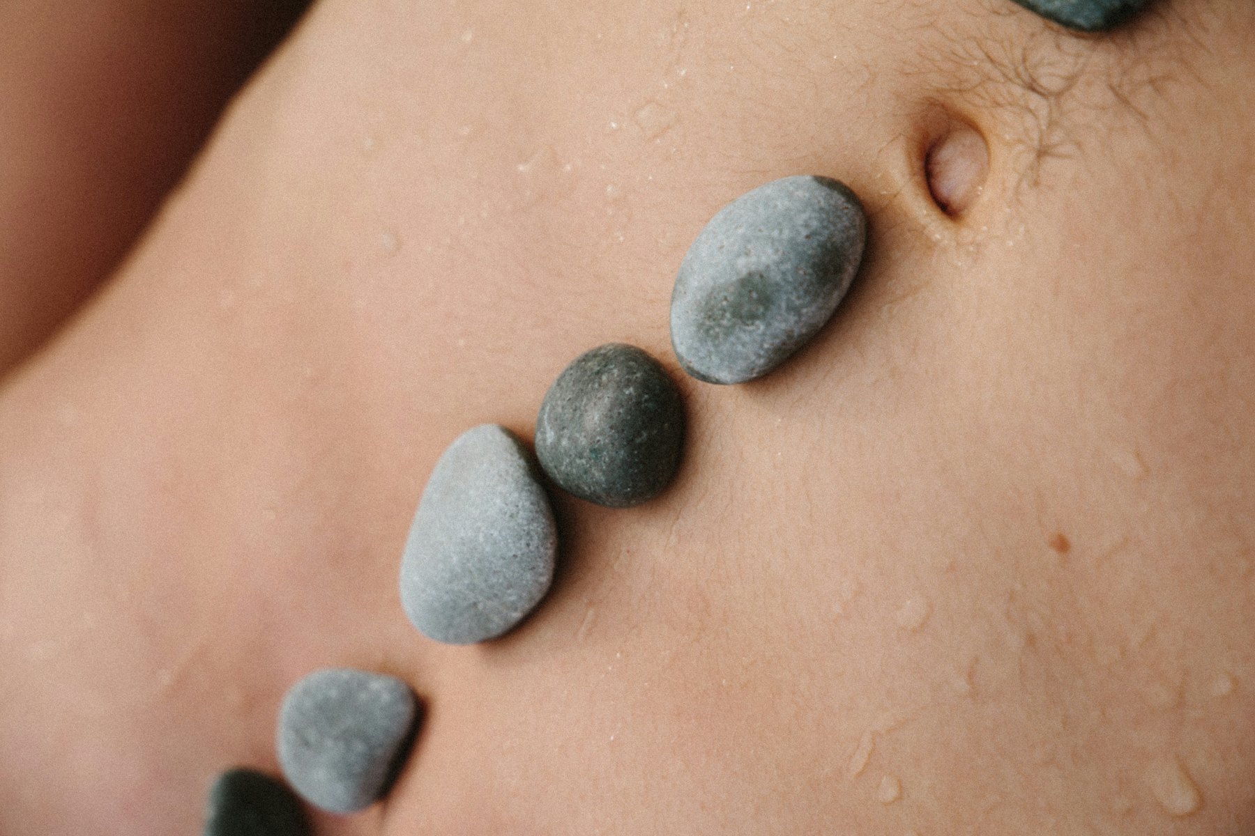 Smooth stones resting along the spine